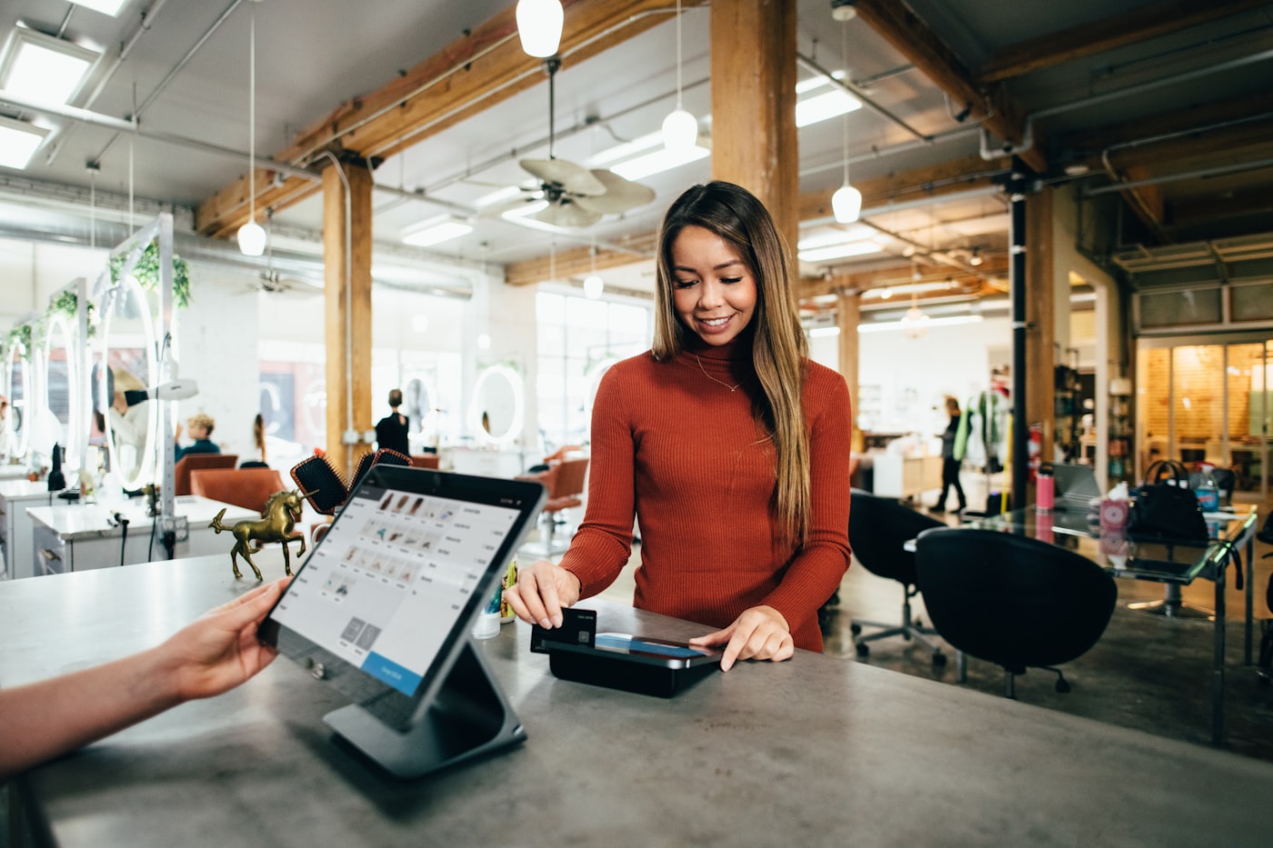 A small-business owner at the counter of her shop