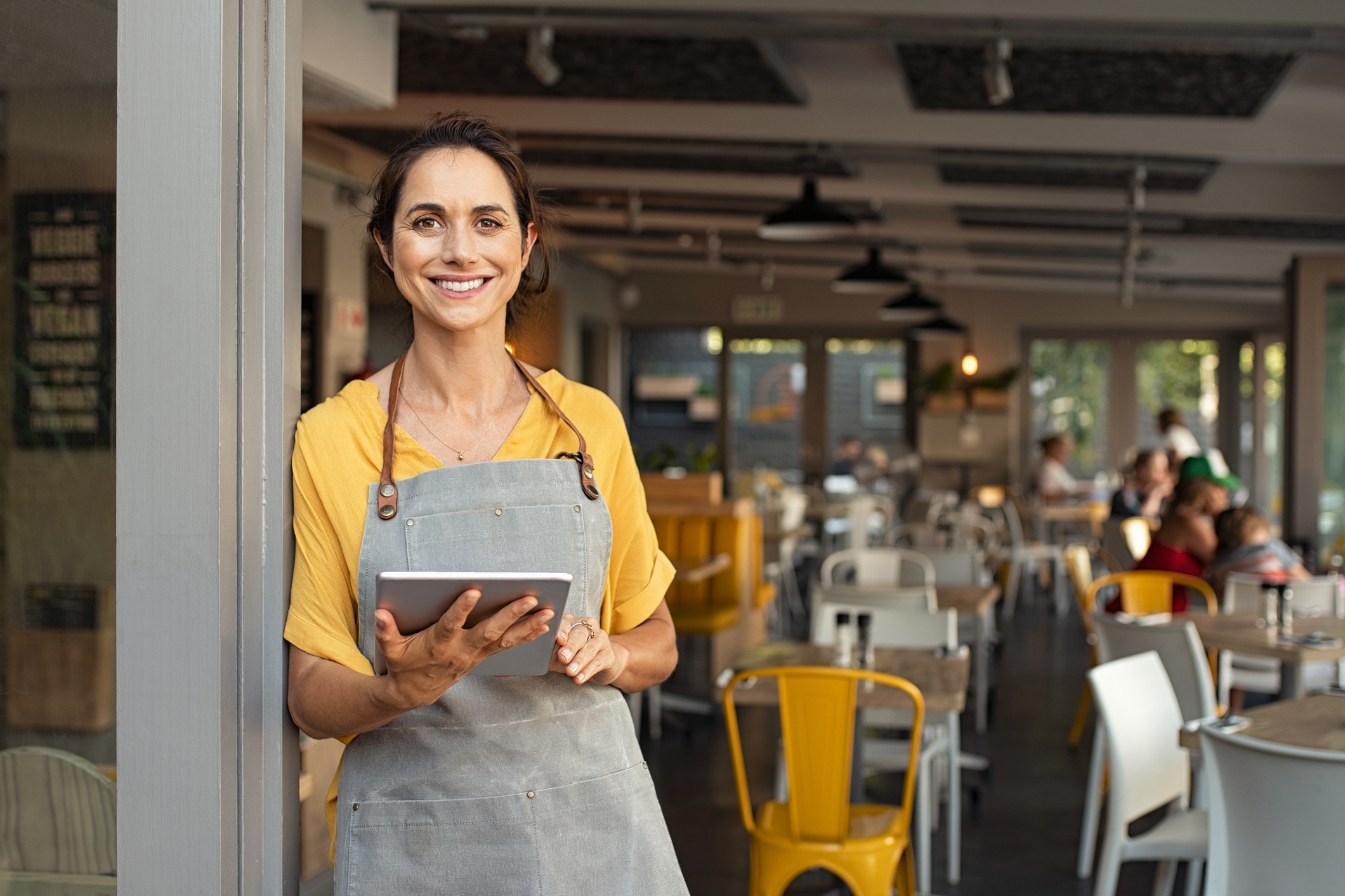 A business owner reviewing her trademark renewal paperwork